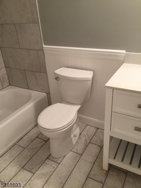 16 Stevens Court Bedminster, NJ 07921 - Photo 9 of 9 a white toilet sitting next to a bathroom sink