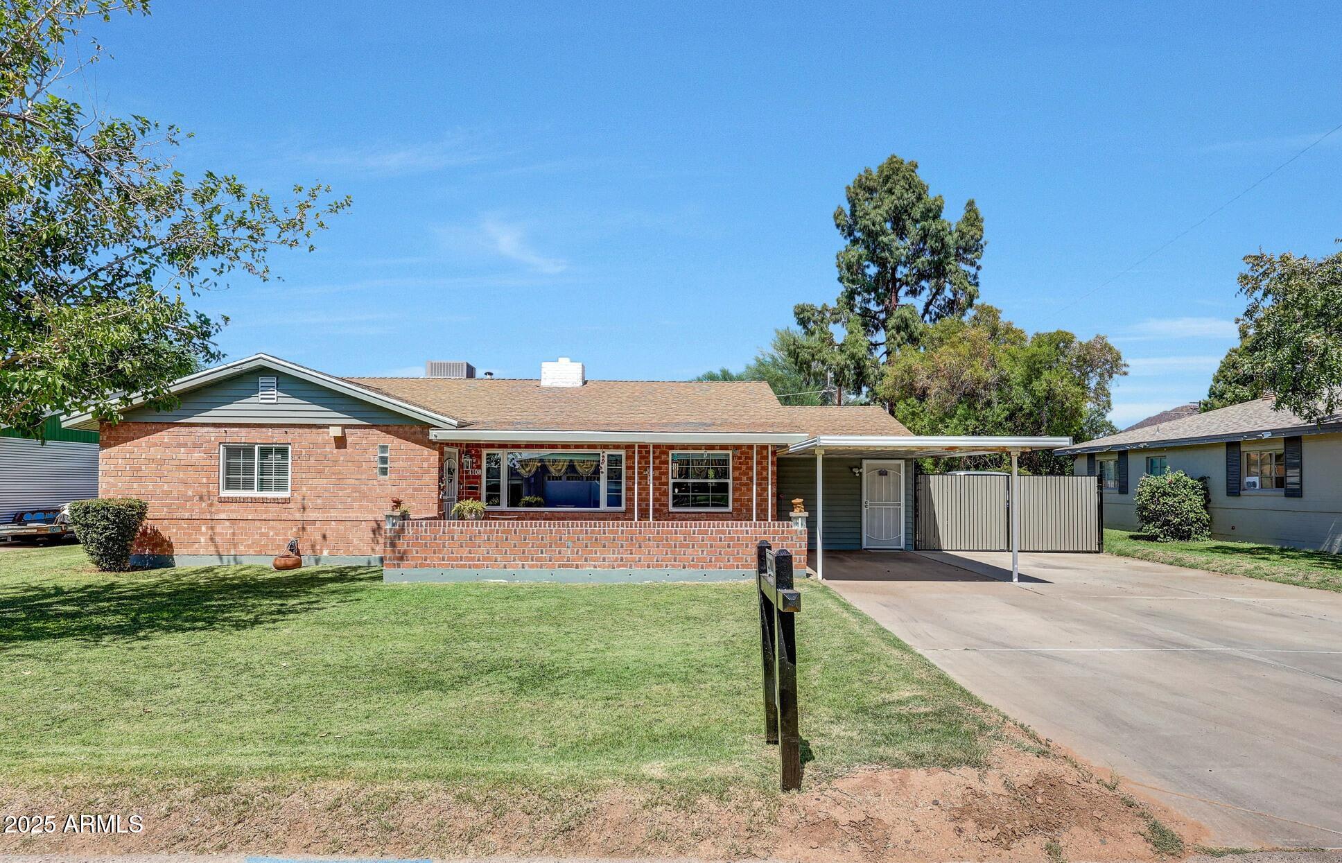 4108 East Edgemont Avenue Phoenix, AZ 85018 - Photo 1 of 118 a view of a house with a backyard