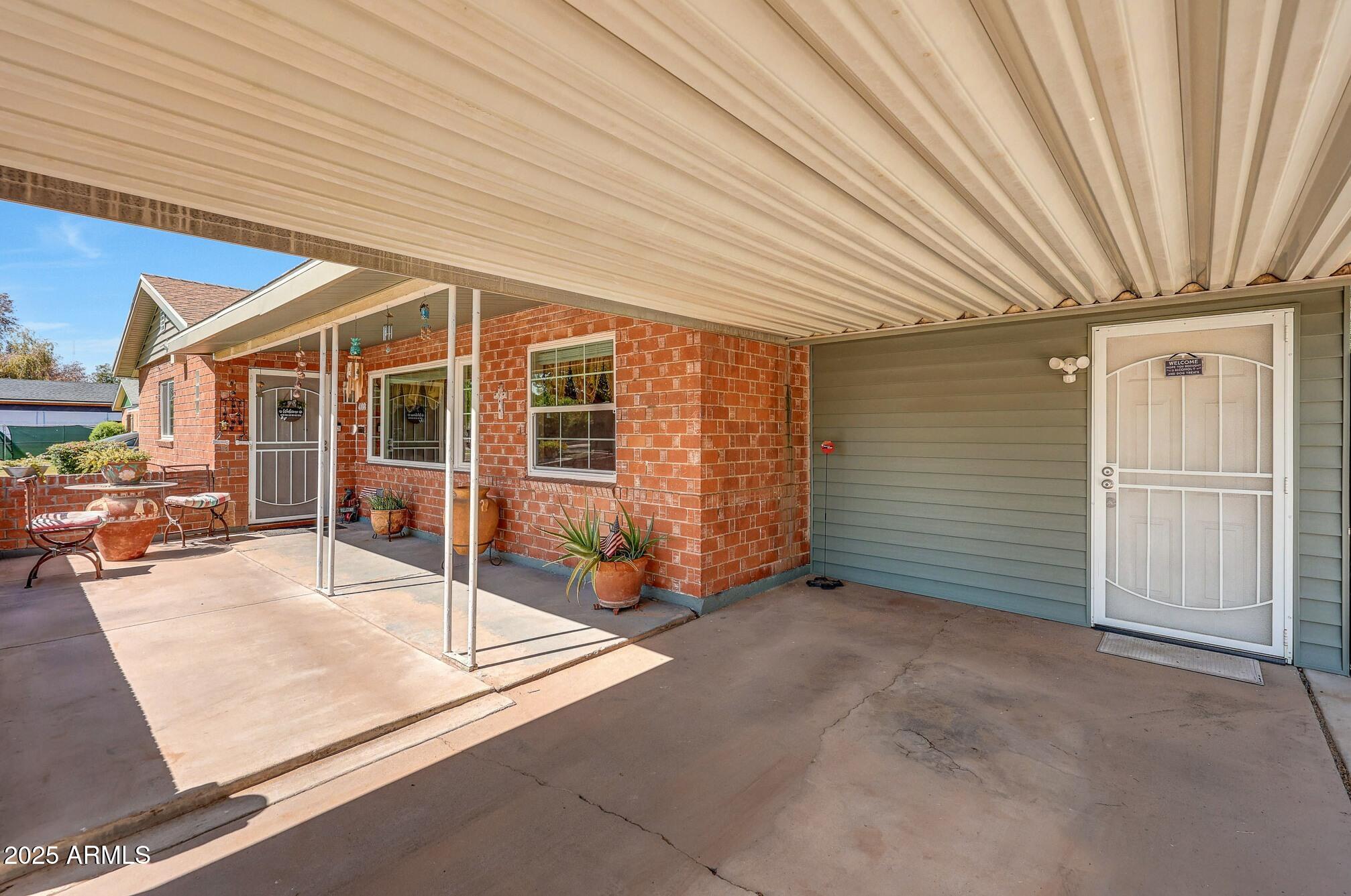 4108 East Edgemont Avenue Phoenix, AZ 85018 - Photo 12 of 118 an empty room with windows