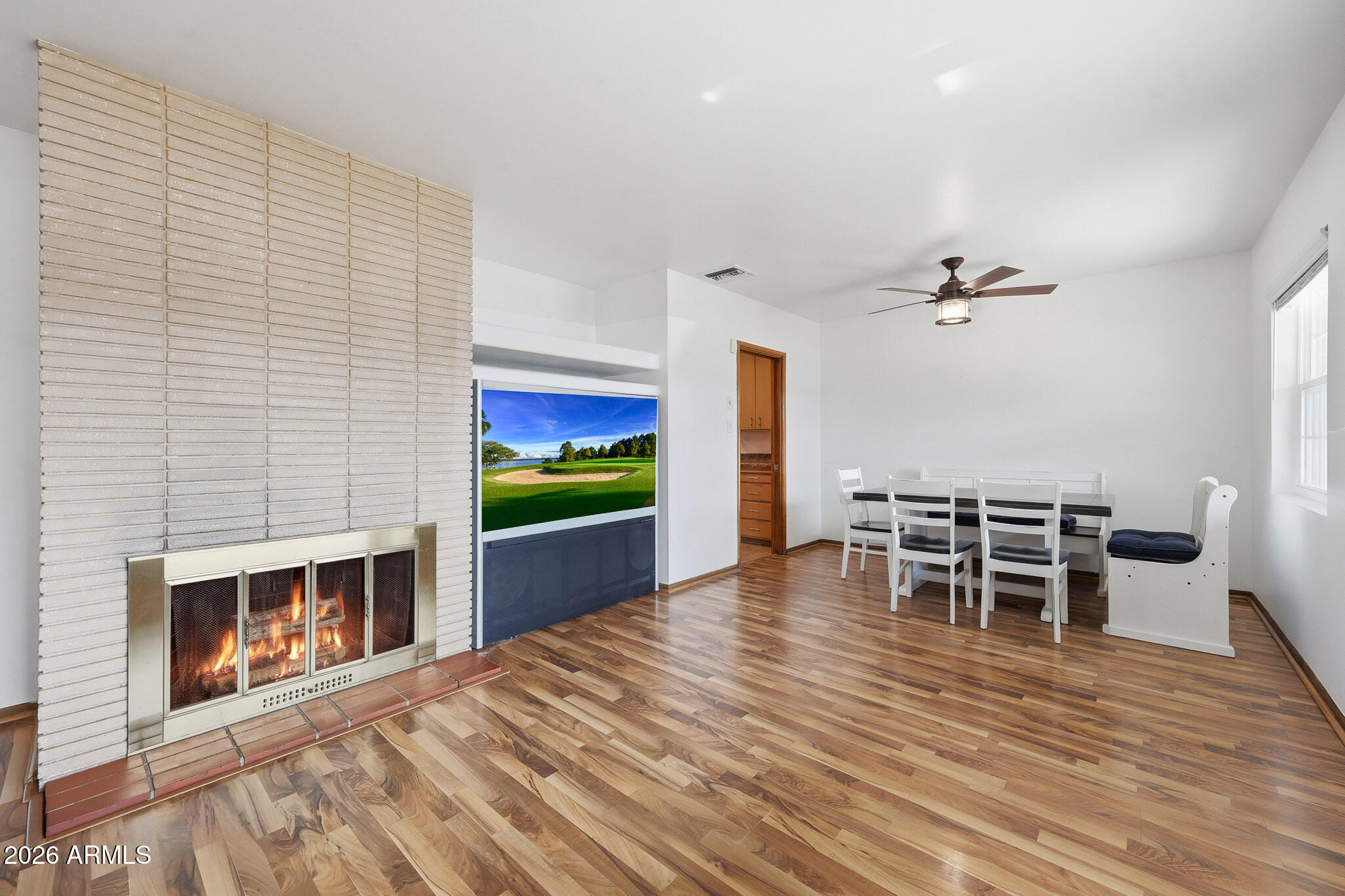 4108 East Edgemont Avenue Phoenix, AZ 85018 - Photo 15 of 118 a view of a livingroom with furniture and wooden floor