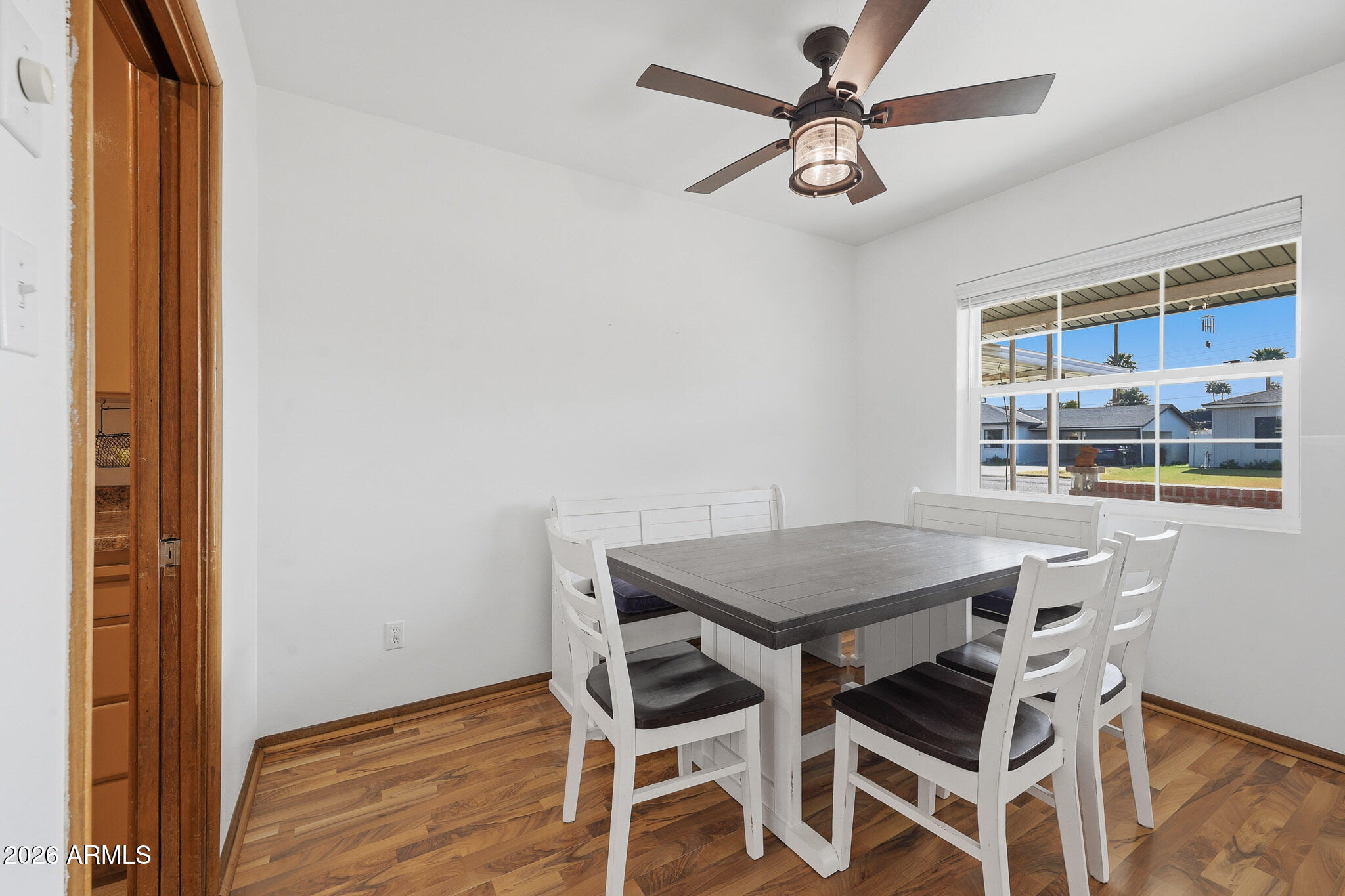 4108 East Edgemont Avenue Phoenix, AZ 85018 - Photo 18 of 118 a view of a dining room with furniture and wooden floor