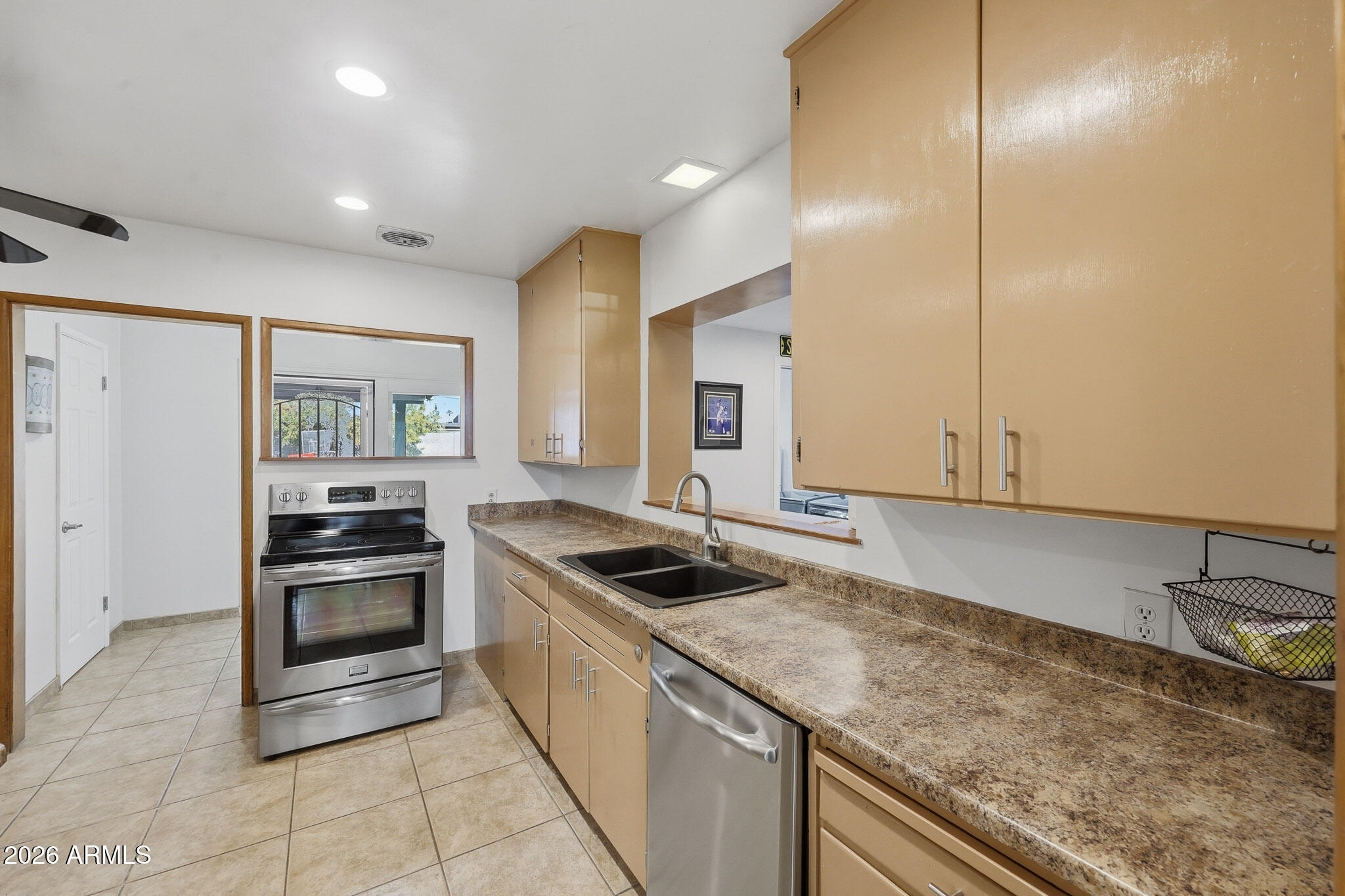 4108 East Edgemont Avenue Phoenix, AZ 85018 - Photo 21 of 118 a kitchen with granite countertop a sink and stainless steel appliances