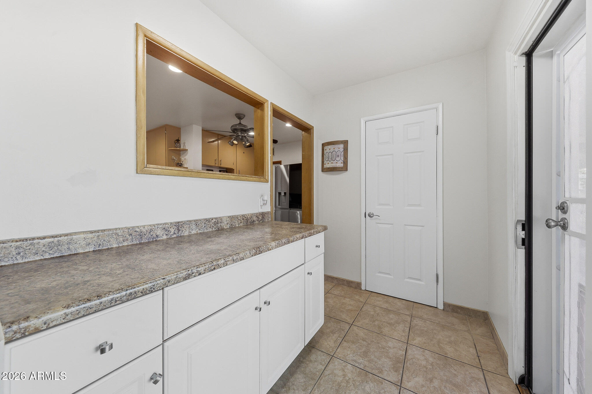 4108 East Edgemont Avenue Phoenix, AZ 85018 - Photo 27 of 118 a hallway with sink and mirror