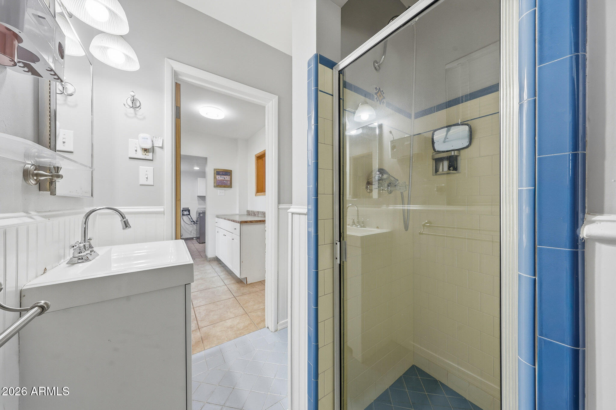 4108 East Edgemont Avenue Phoenix, AZ 85018 - Photo 35 of 118 a bathroom with a granite countertop sink mirror and shower
