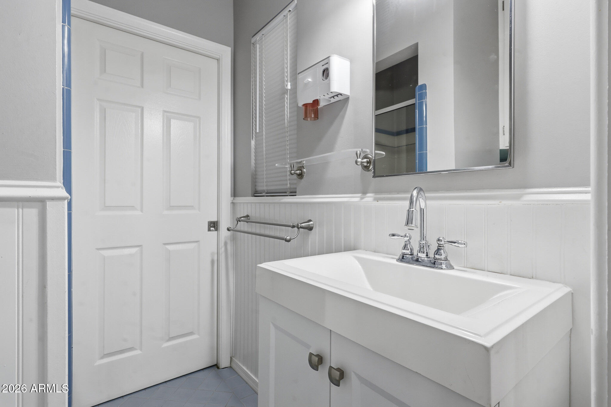 4108 East Edgemont Avenue Phoenix, AZ 85018 - Photo 38 of 118 a bathroom with a sink and a mirror