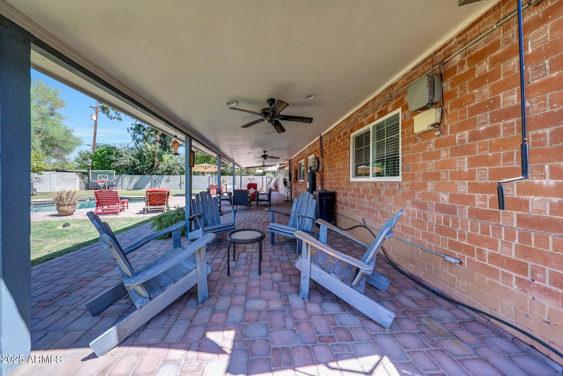 4108 East Edgemont Avenue Phoenix, AZ 85018 - Photo 48 of 118 a view of a patio with a table and chairs
