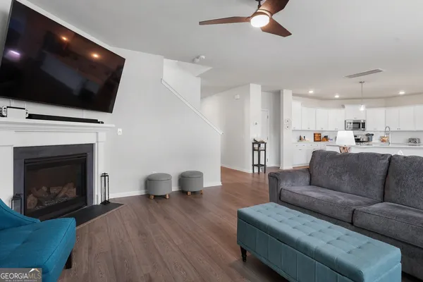 a living room with furniture and a flat screen tv
