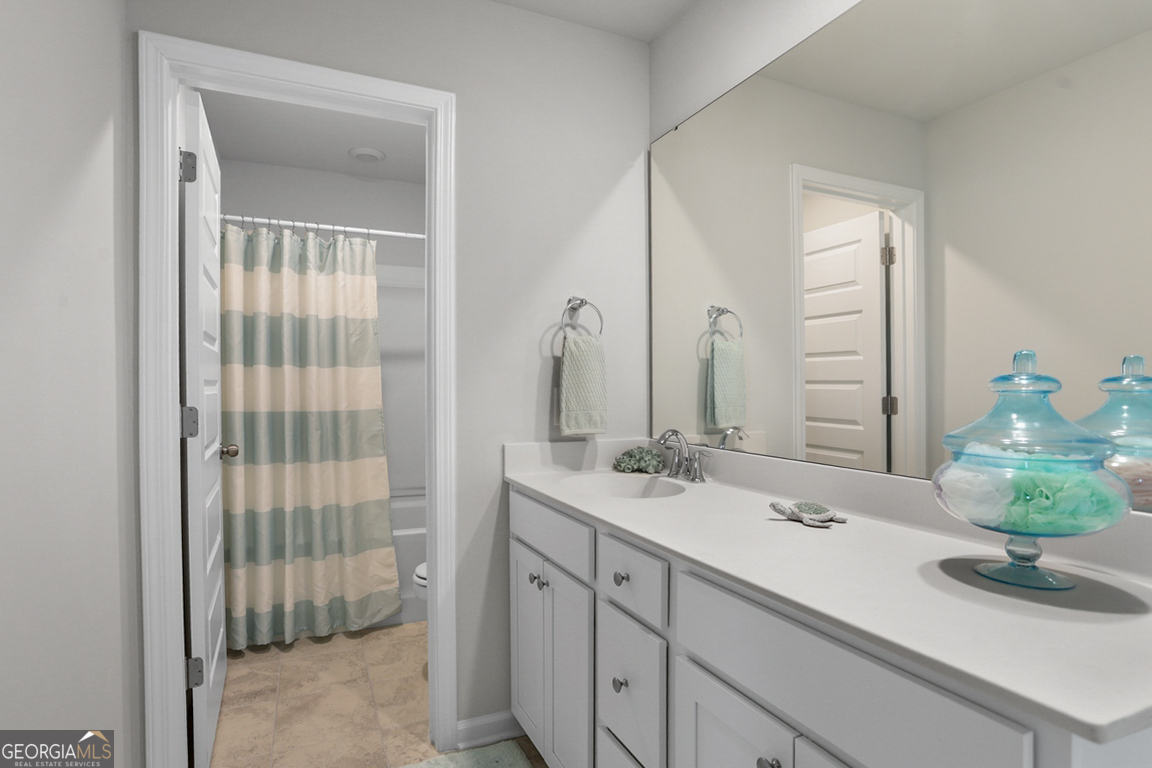 102 Franklins Walk Rincon, GA 31326 - Photo 26 of 51 a bathroom with a double vanity sink and a mirror