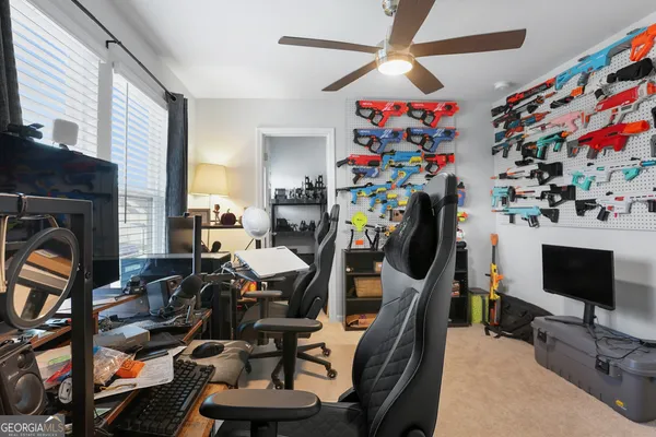 a room with gym equipment and a flat screen tv