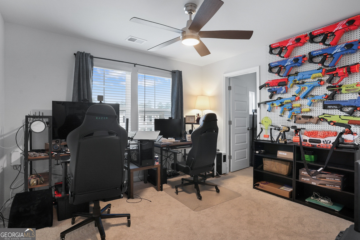 102 Franklins Walk Rincon, GA 31326 - Photo 29 of 51 a view of a workspace with furniture and a window