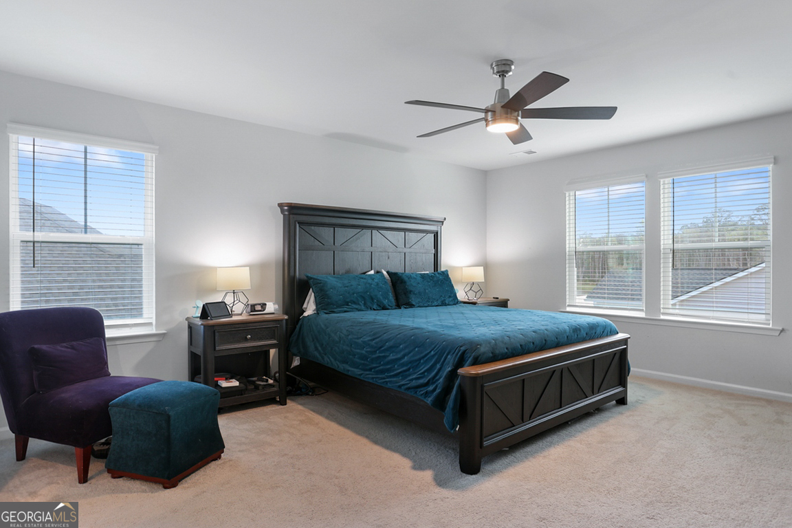 102 Franklins Walk Rincon, GA 31326 - Photo 31 of 51 a bed sitting in a bedroom next to a window