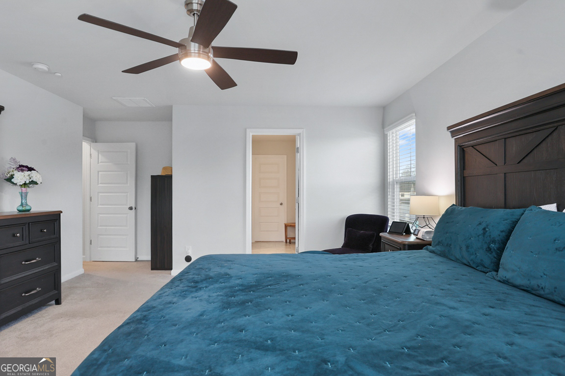 102 Franklins Walk Rincon, GA 31326 - Photo 32 of 51 a bedroom with a bed and a dresser