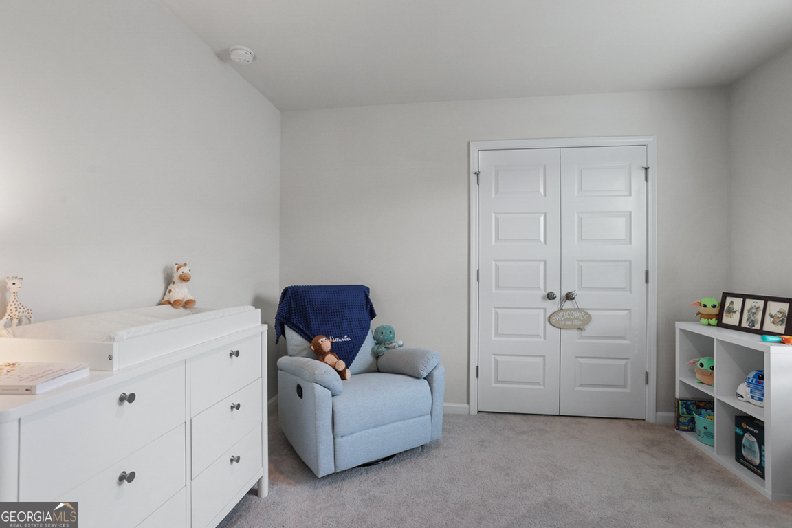 102 Franklins Walk Rincon, GA 31326 - Photo 41 of 51 a room with a baby crib and a dresser