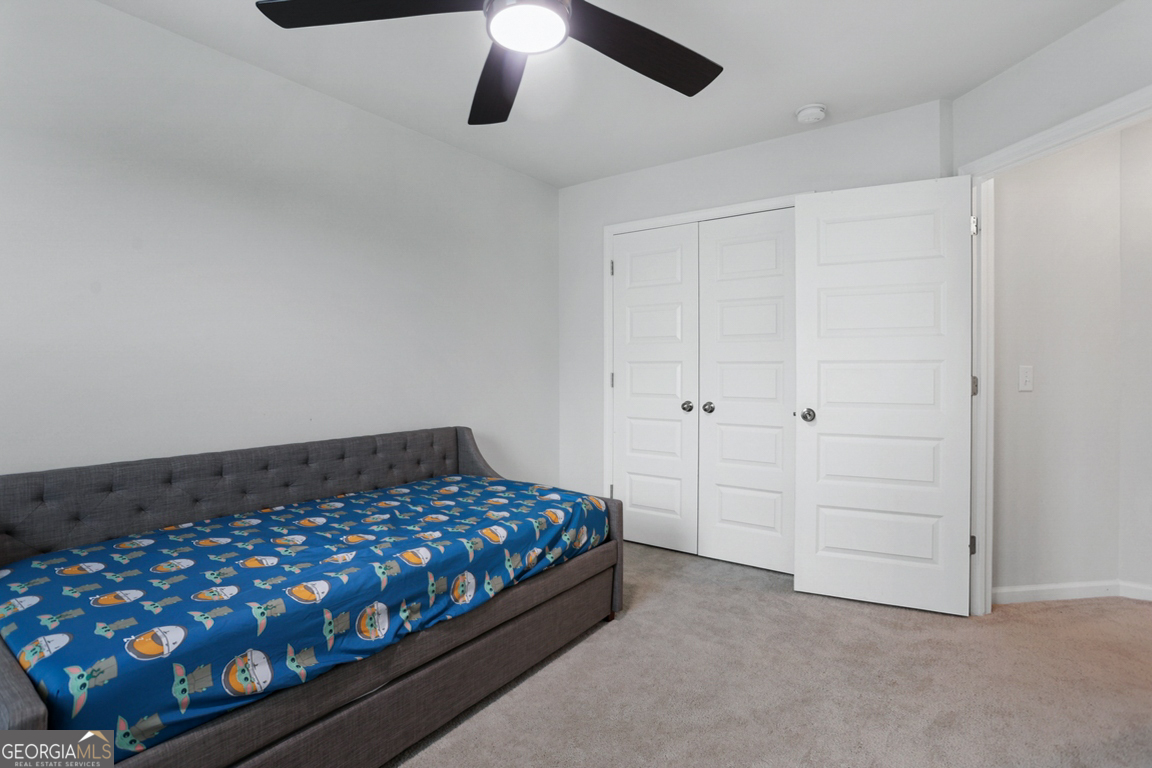 102 Franklins Walk Rincon, GA 31326 - Photo 43 of 51 a bedroom with a bed and a ceiling fan