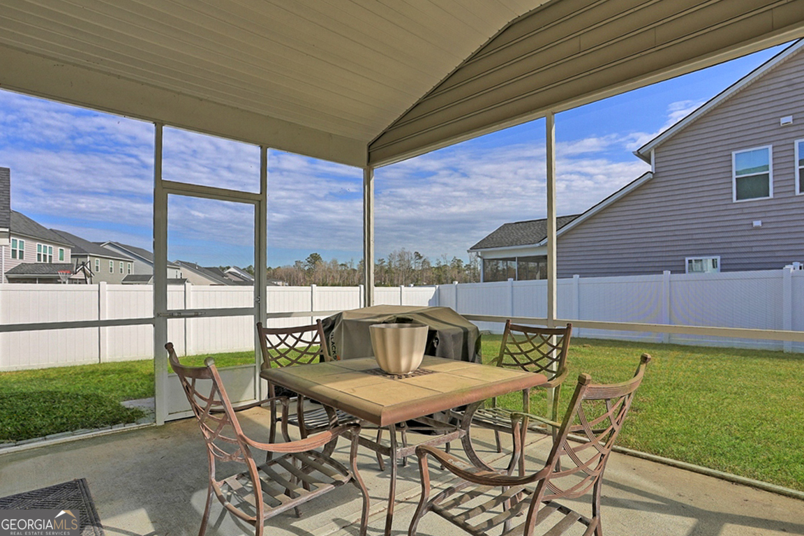 102 Franklins Walk Rincon, GA 31326 - Photo 45 of 51 a view of a patio with a table chairs and a table