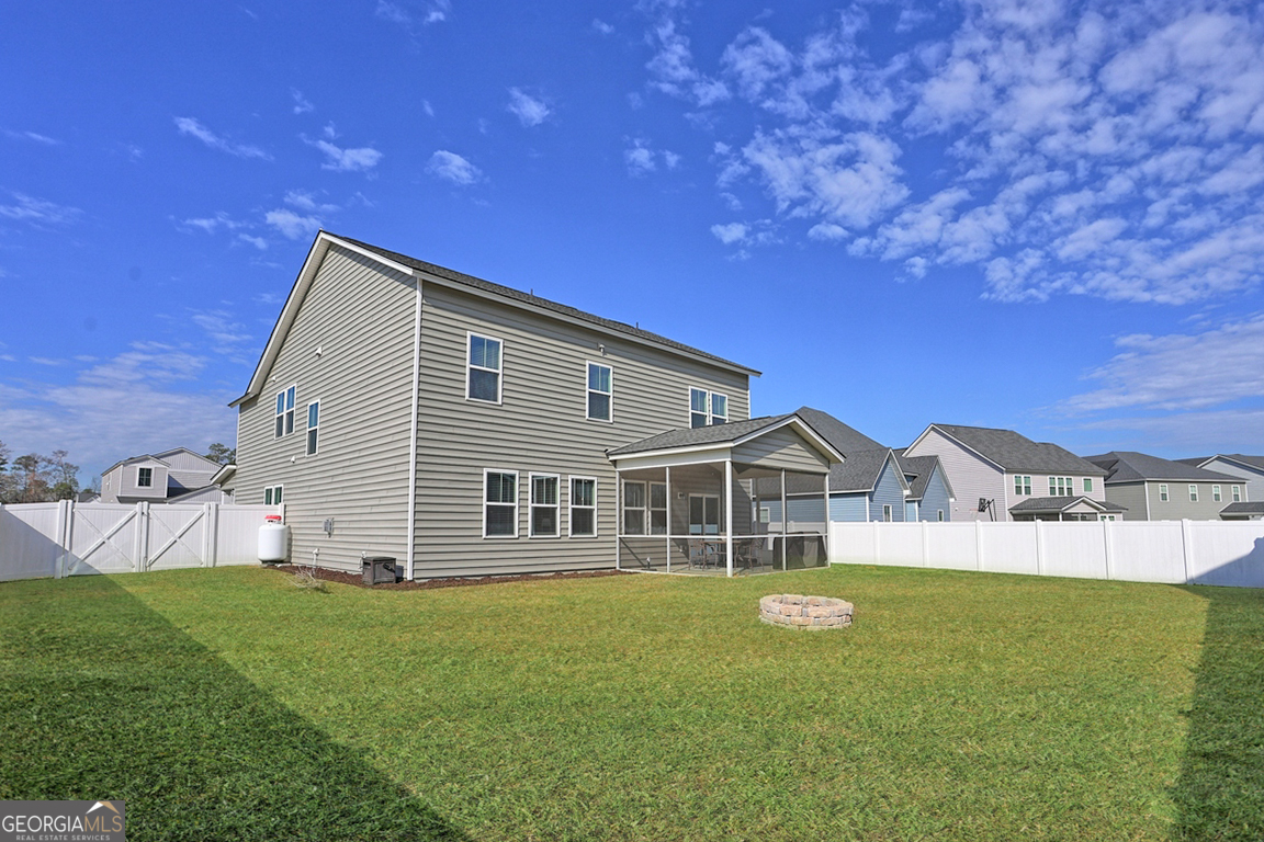 102 Franklins Walk Rincon, GA 31326 - Photo 49 of 51 a view of a house with a backyard