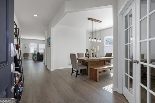 a view of a dining room with furniture and wooden floor