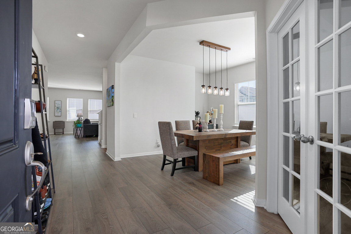 102 Franklins Walk Rincon, GA 31326 - Photo 6 of 51 a view of a dining room with furniture and wooden floor