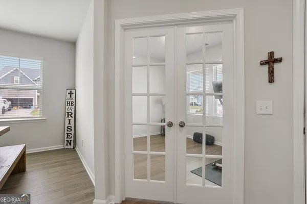 a living room with furniture and wooden floor