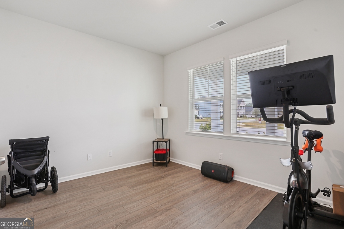 102 Franklins Walk Rincon, GA 31326 - Photo 8 of 51 a room with furniture and a flat screen tv