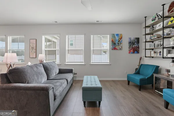 a living room with furniture and a window