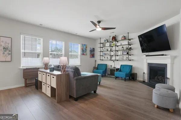 a living room with furniture and a window