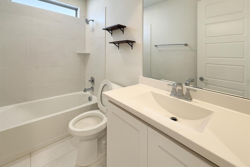 5924 Owen Road McKinney, TX 75071 - Photo 15 of 40 a bathroom with a sink toilet and shower