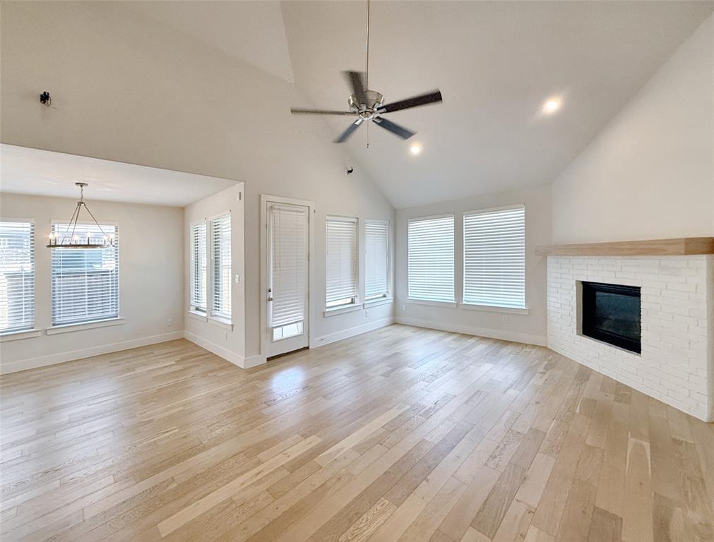 5924 Owen Road McKinney, TX 75071 - Photo 6 of 40 a view of empty room with wooden floor and fireplace