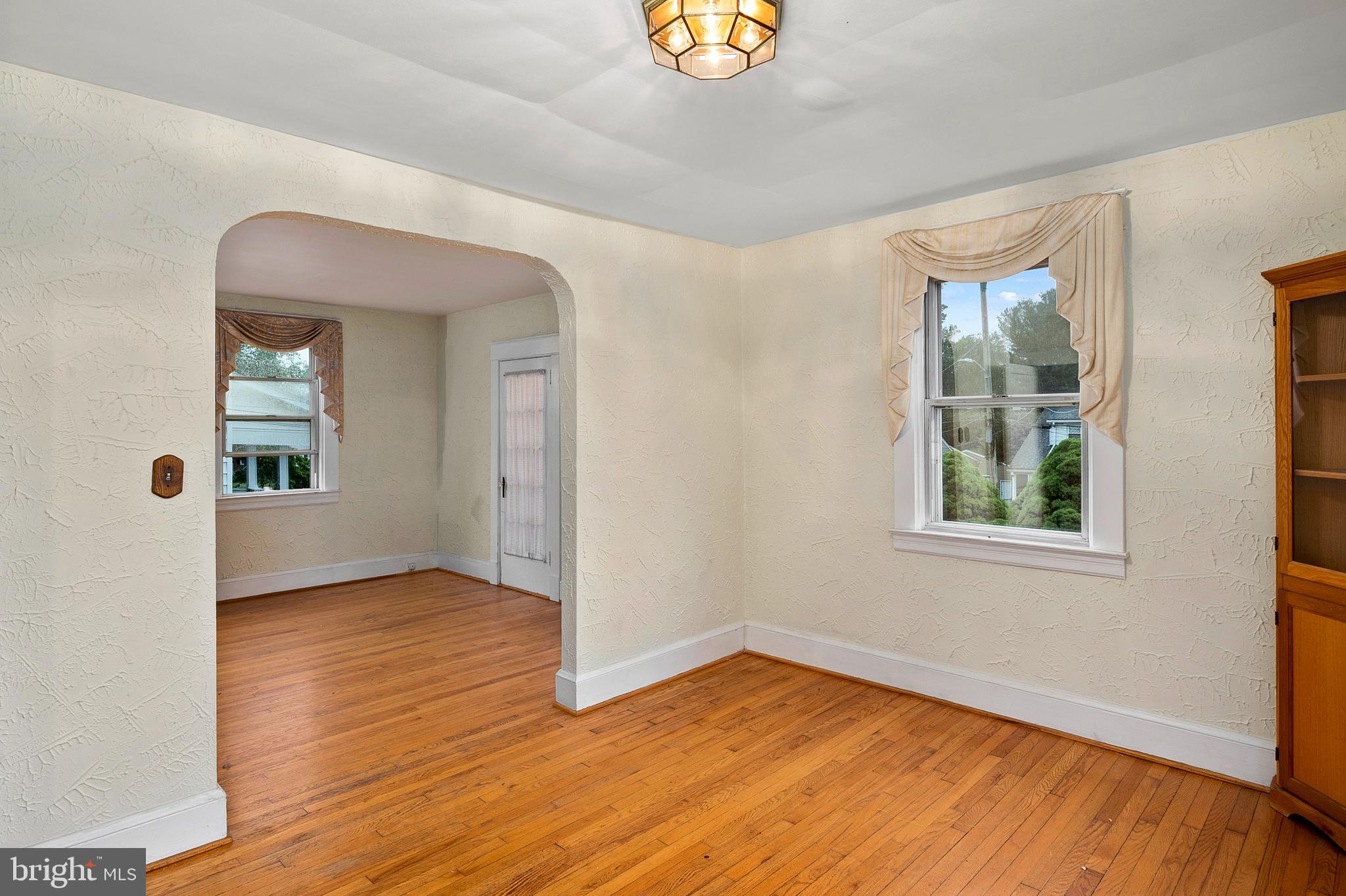 1240 Greystone Road Halethorpe, MD 21227 - Photo 13 of 41 an empty room with wooden floor and windows