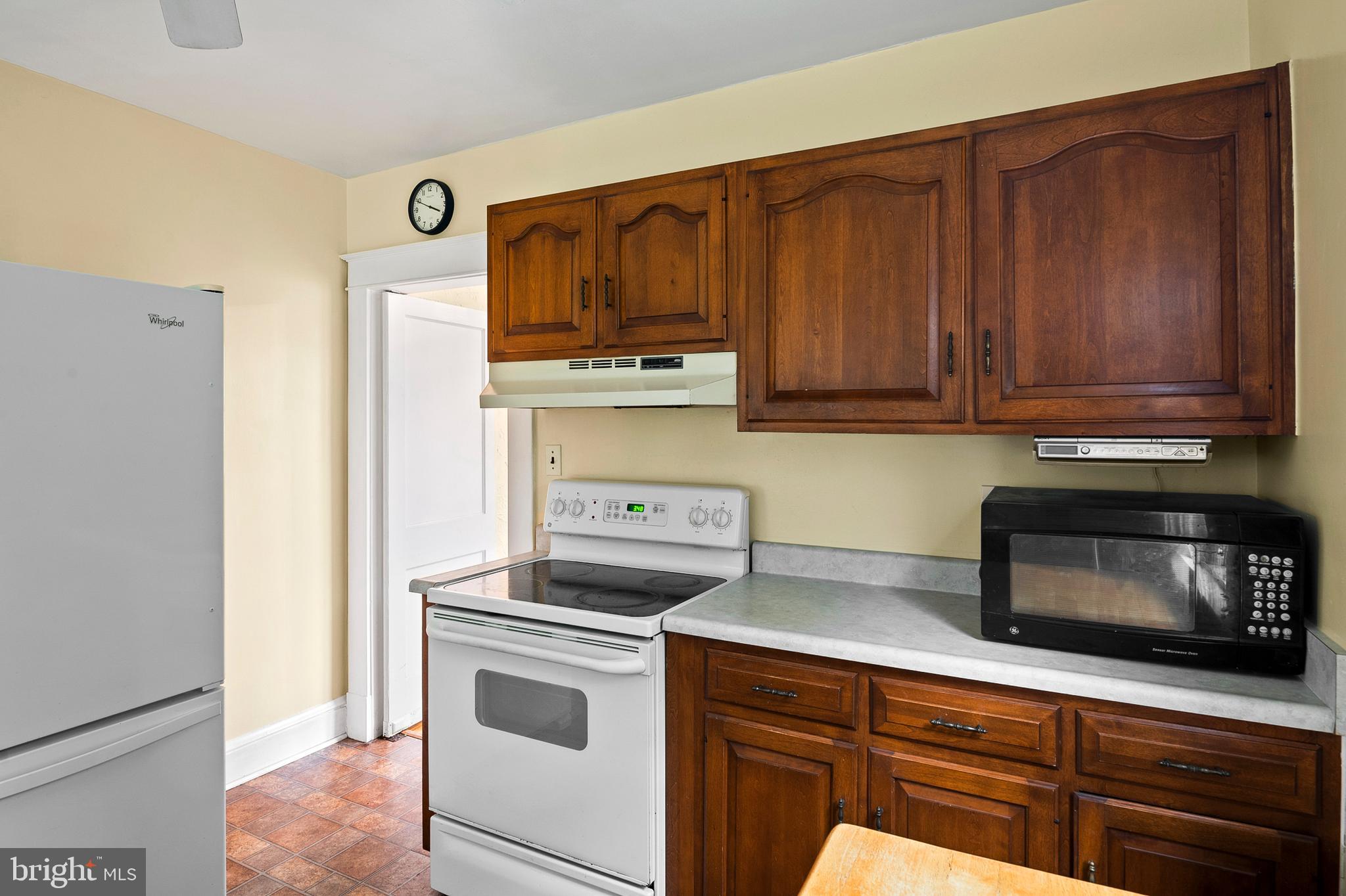 1240 Greystone Road Halethorpe, MD 21227 - Photo 16 of 41 a kitchen with stainless steel appliances granite countertop a refrigerator and a stove top oven
