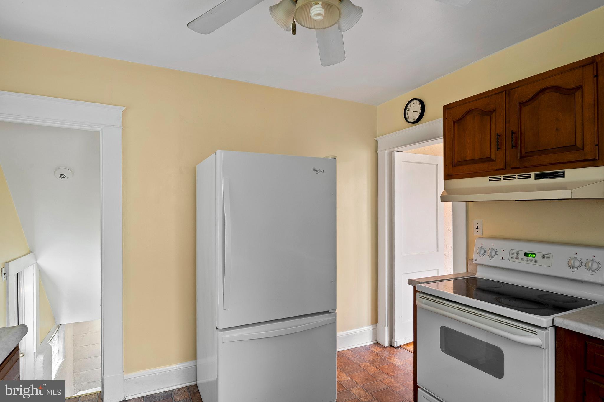 1240 Greystone Road Halethorpe, MD 21227 - Photo 17 of 41 a kitchen with stainless steel appliances a stove a refrigerator and cabinets