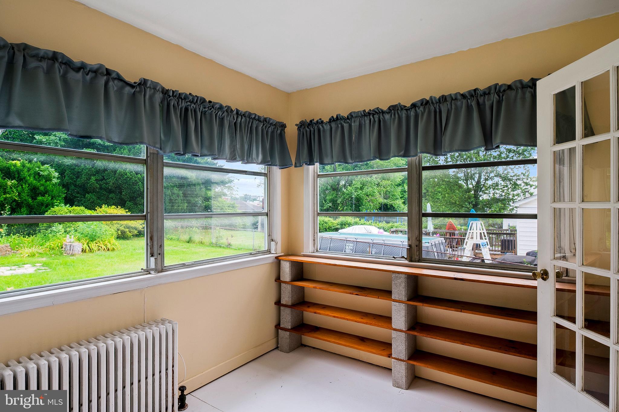 1240 Greystone Road Halethorpe, MD 21227 - Photo 21 of 41 a view of room with green walls and a large window
