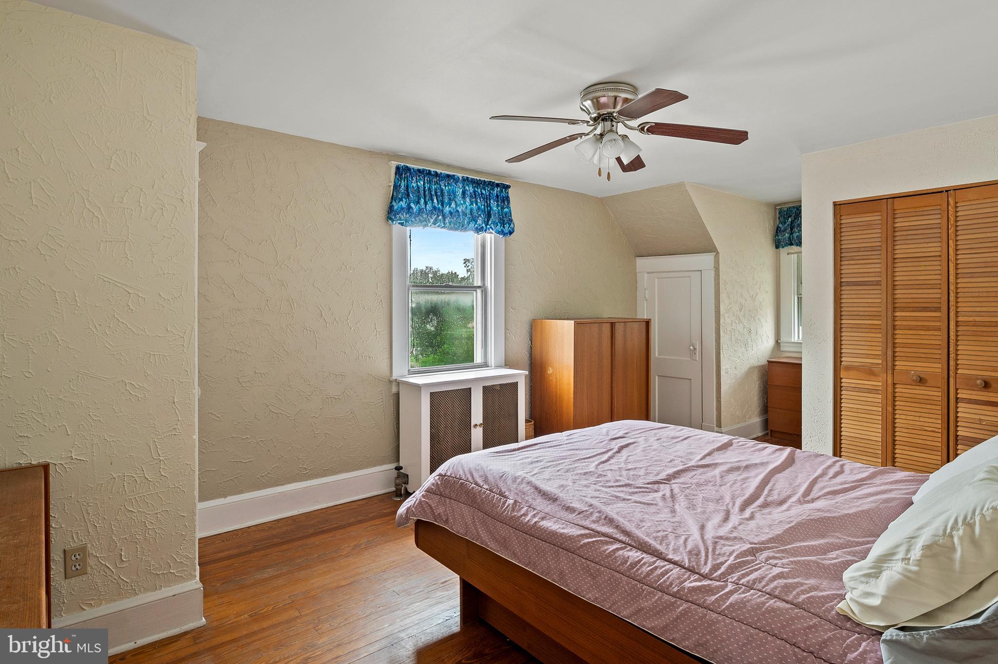1240 Greystone Road Halethorpe, MD 21227 - Photo 24 of 41 a bedroom with a large bed and a window