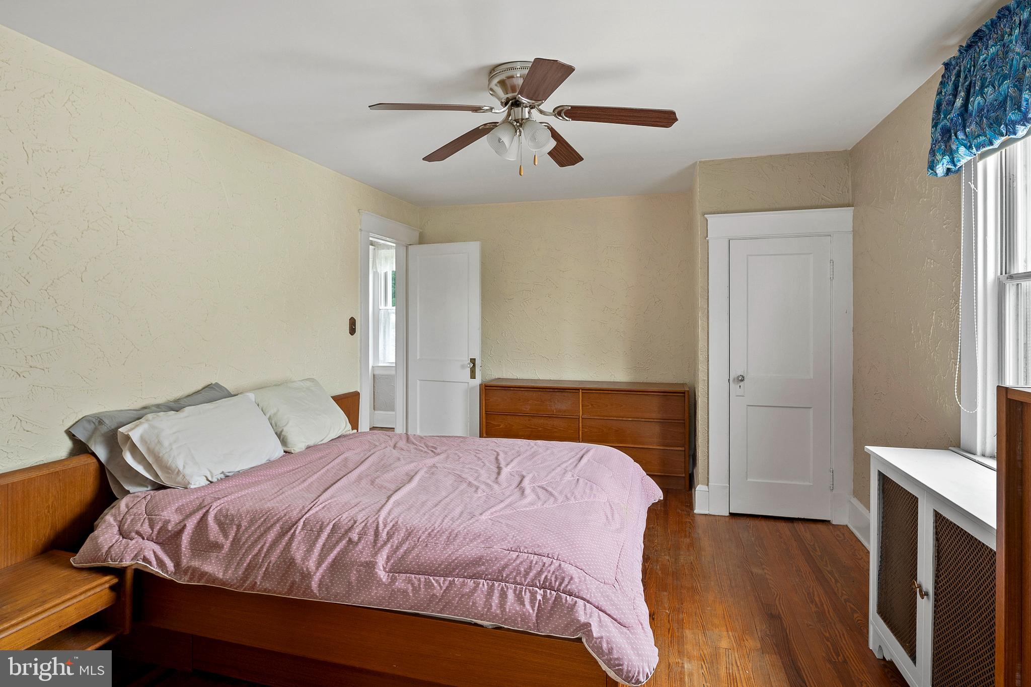 1240 Greystone Road Halethorpe, MD 21227 - Photo 25 of 41 a bedroom with a bed and a chandelier