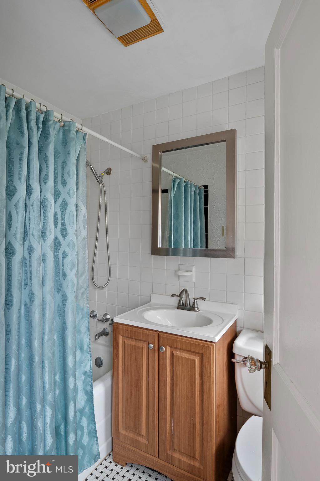 1240 Greystone Road Halethorpe, MD 21227 - Photo 26 of 41 a bathroom with a sink toilet and shower