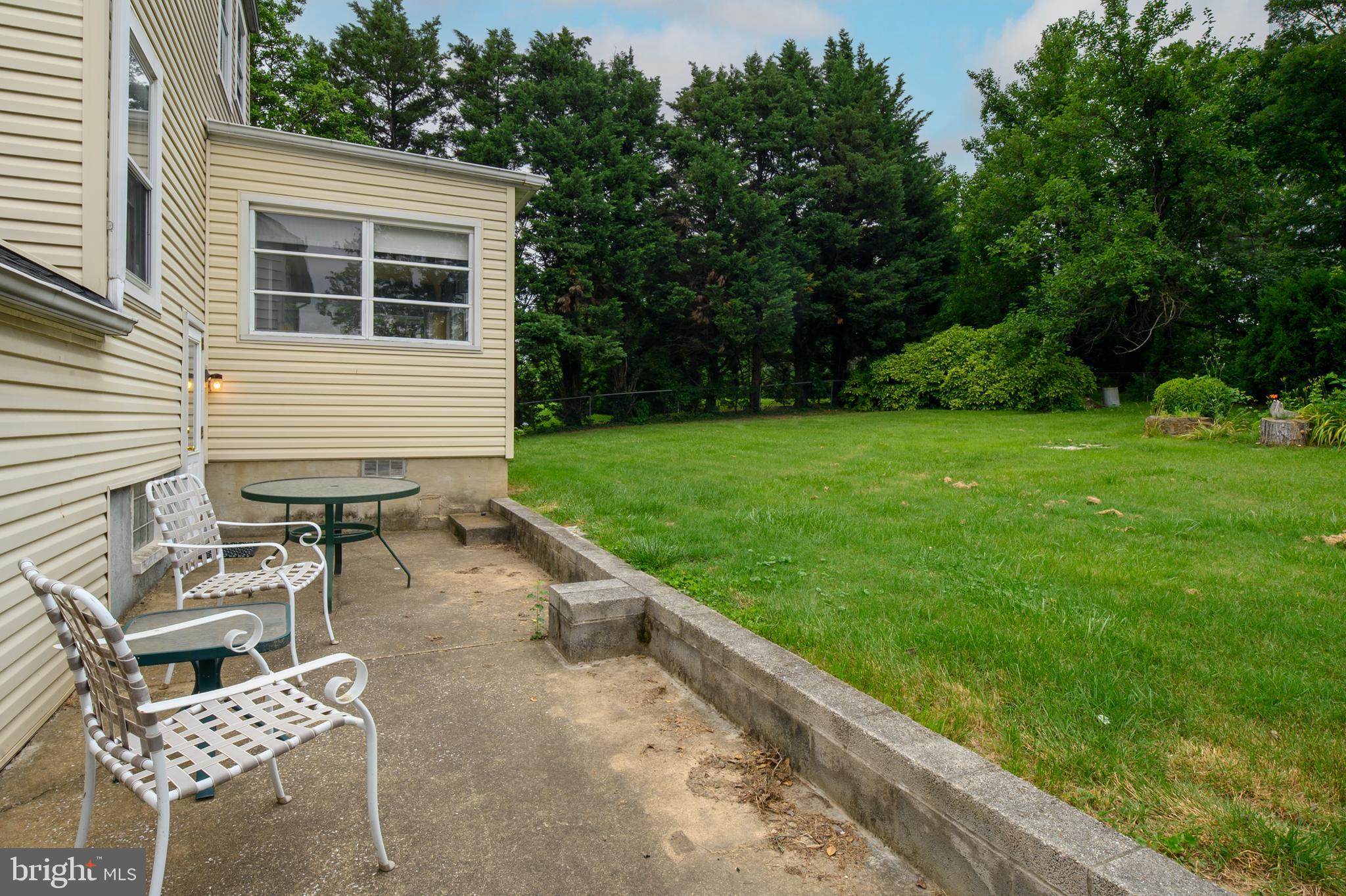 1240 Greystone Road Halethorpe, MD 21227 - Photo 35 of 41 a backyard of a house with seating space