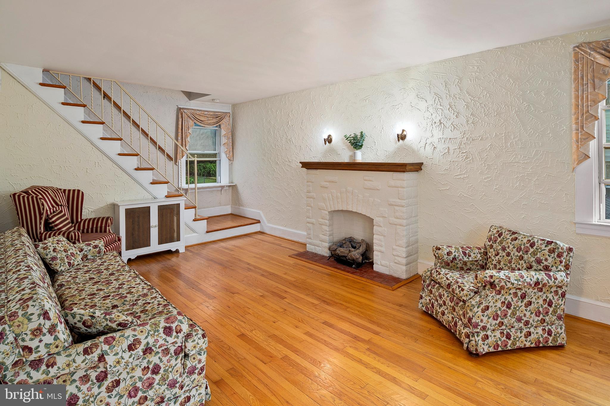 1240 Greystone Road Halethorpe, MD 21227 - Photo 9 of 41 a bedroom with furniture and a fireplace