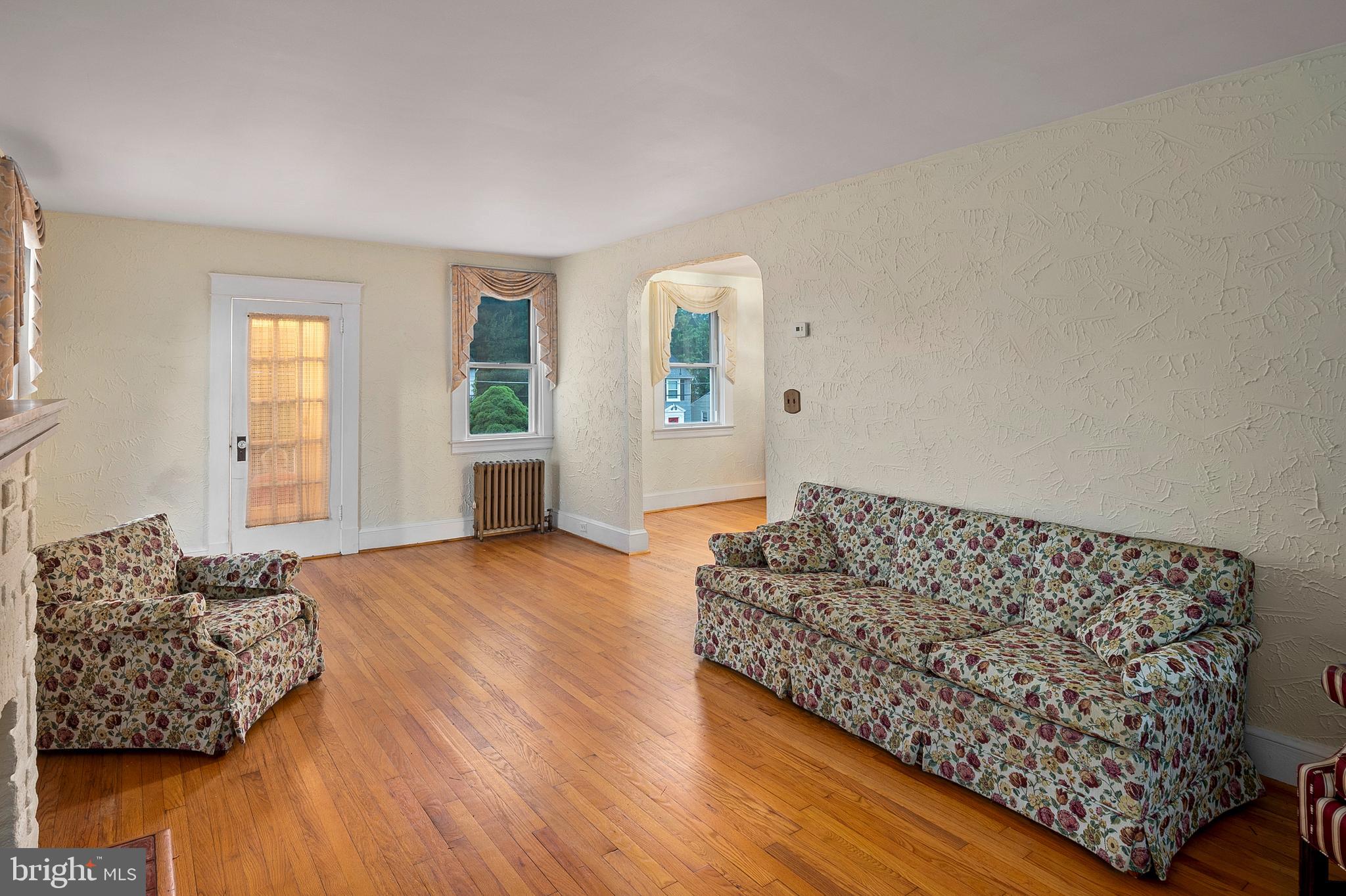 1240 Greystone Road Halethorpe, MD 21227 - Photo 10 of 41 a living room with furniture and a rug