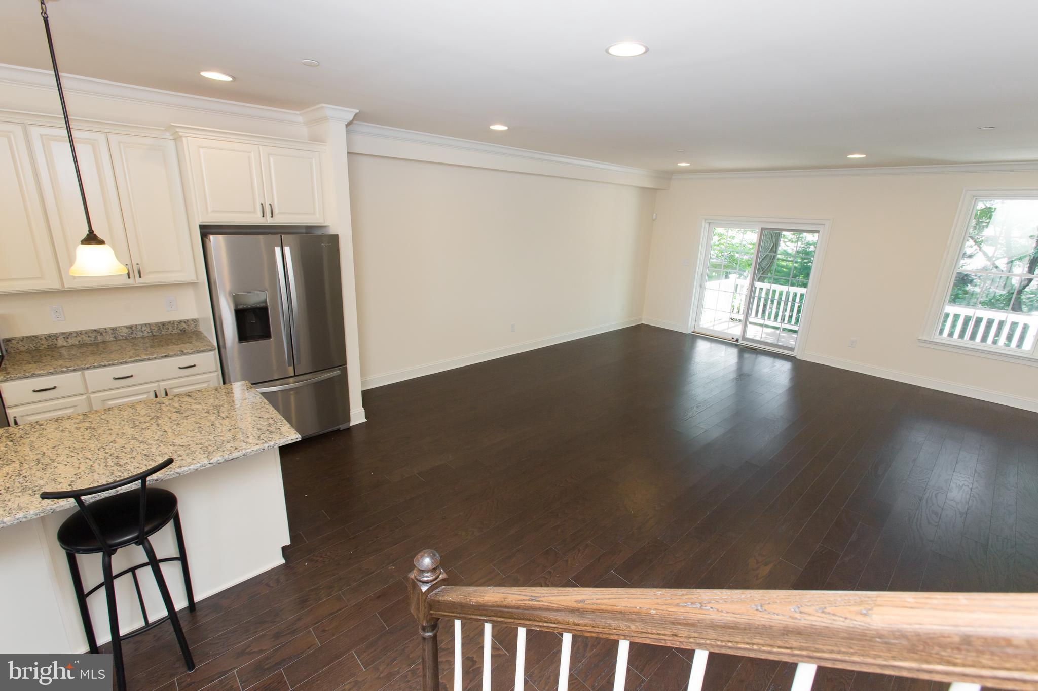 18 Parkview Cir. Wayne, PA 19087 - Photo 11 of 33 a view of a kitchen with wooden floor and a window