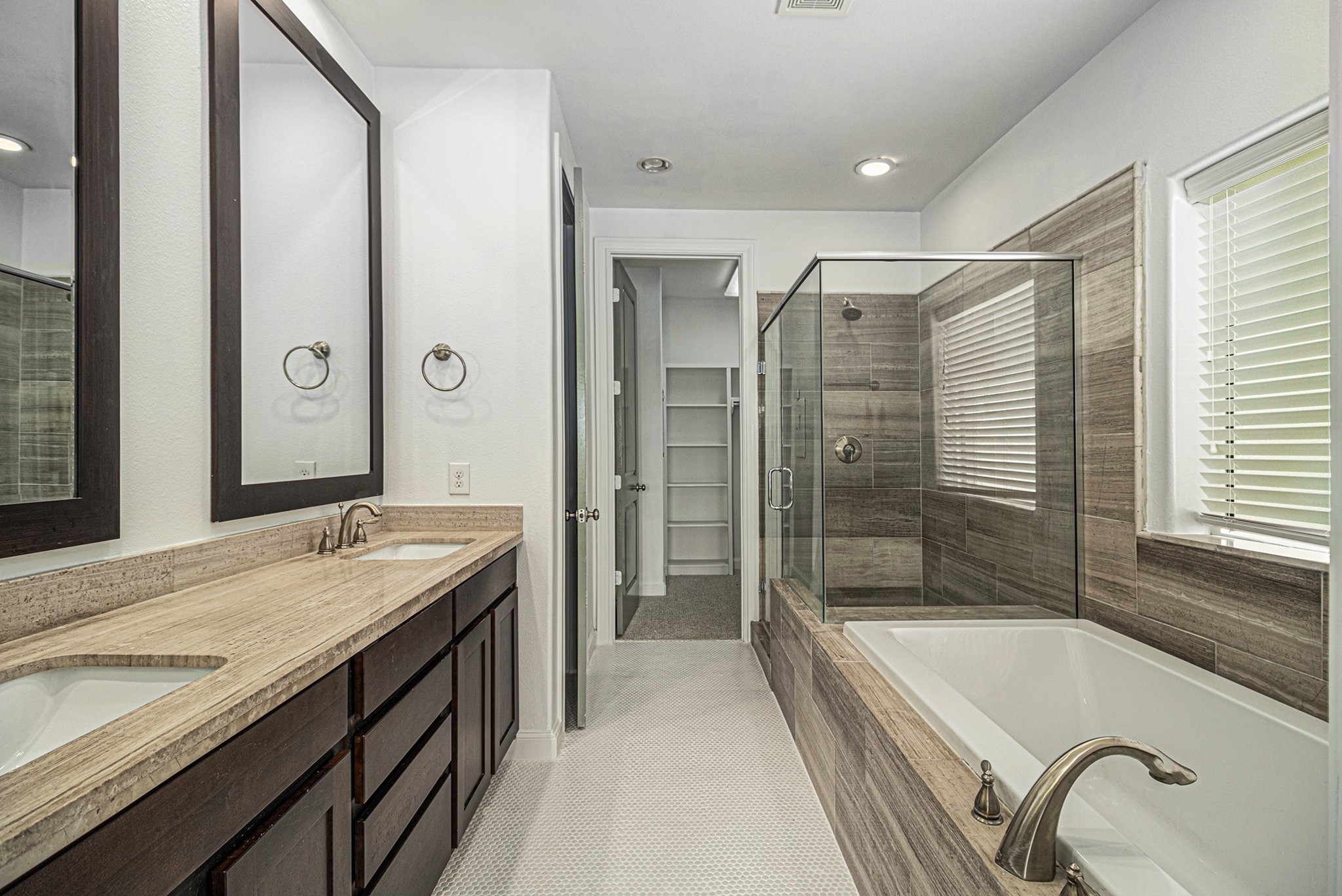 9674 Knight Road Houston, TX 77045 - Photo 18 of 21 a bathroom with a granite countertop tub shower and sink