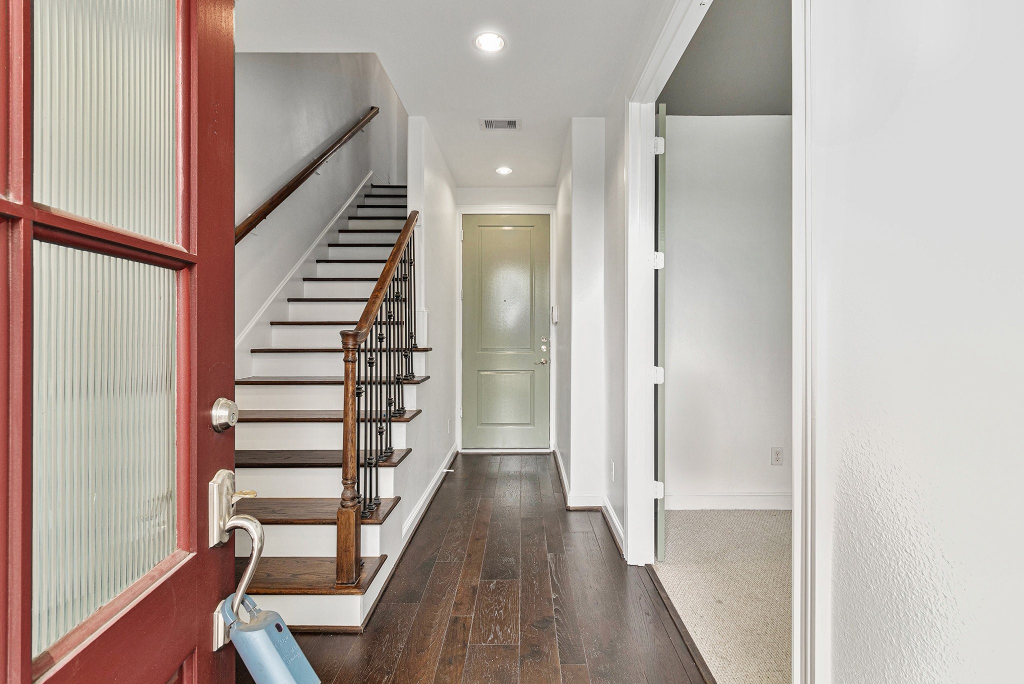 9674 Knight Road Houston, TX 77045 - Photo 5 of 21 a view of a hallway with wooden floor and entryway