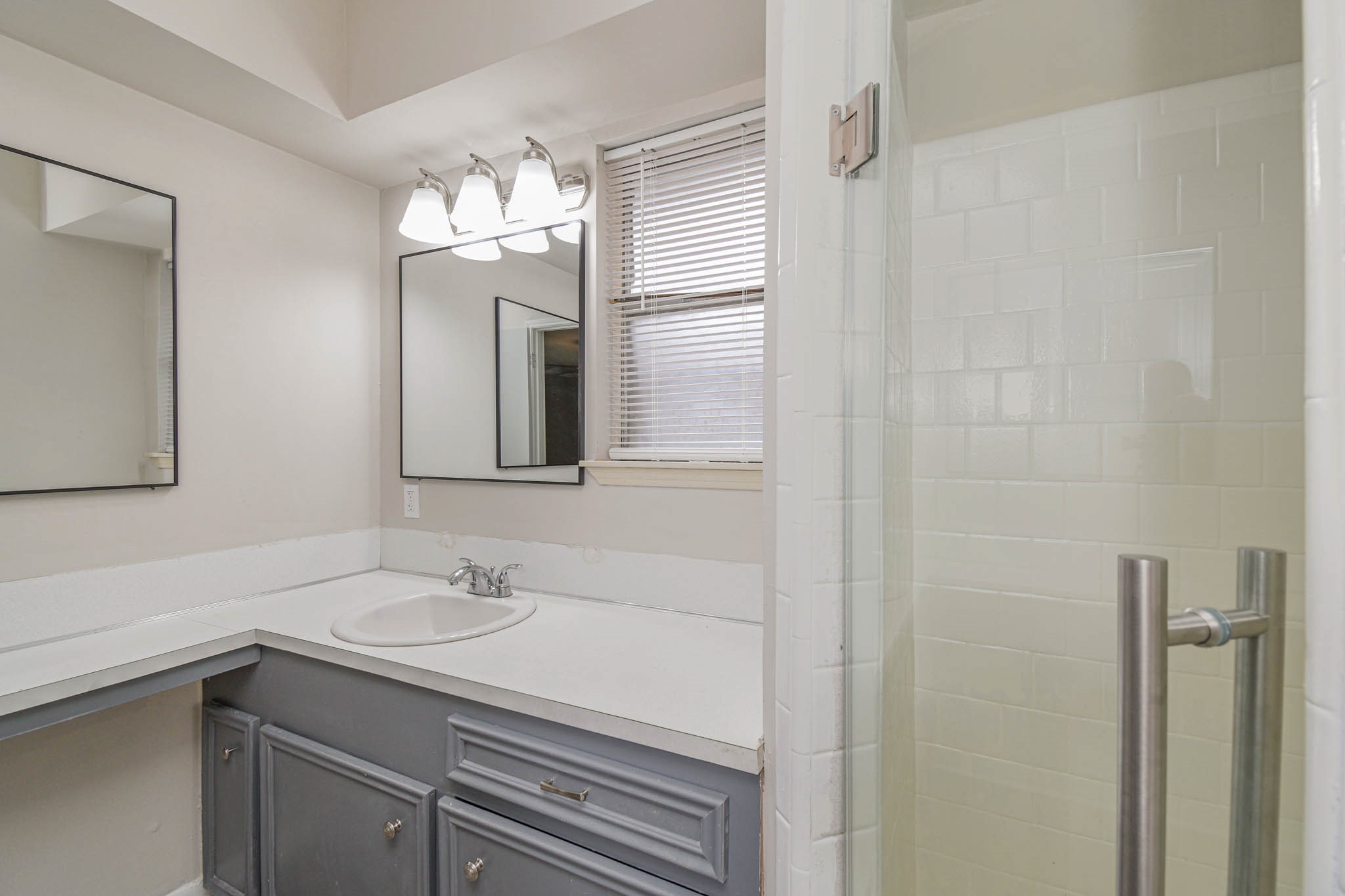 17311 Methil Drive Spring, TX 77379 - Photo 16 of 24 a bathroom with a sink and a mirror