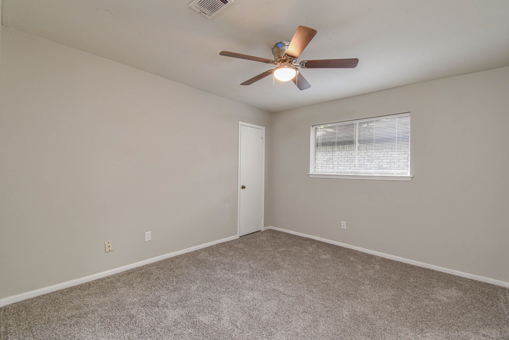 17311 Methil Drive Spring, TX 77379 - Photo 21 of 24 an empty room with a window and a fan