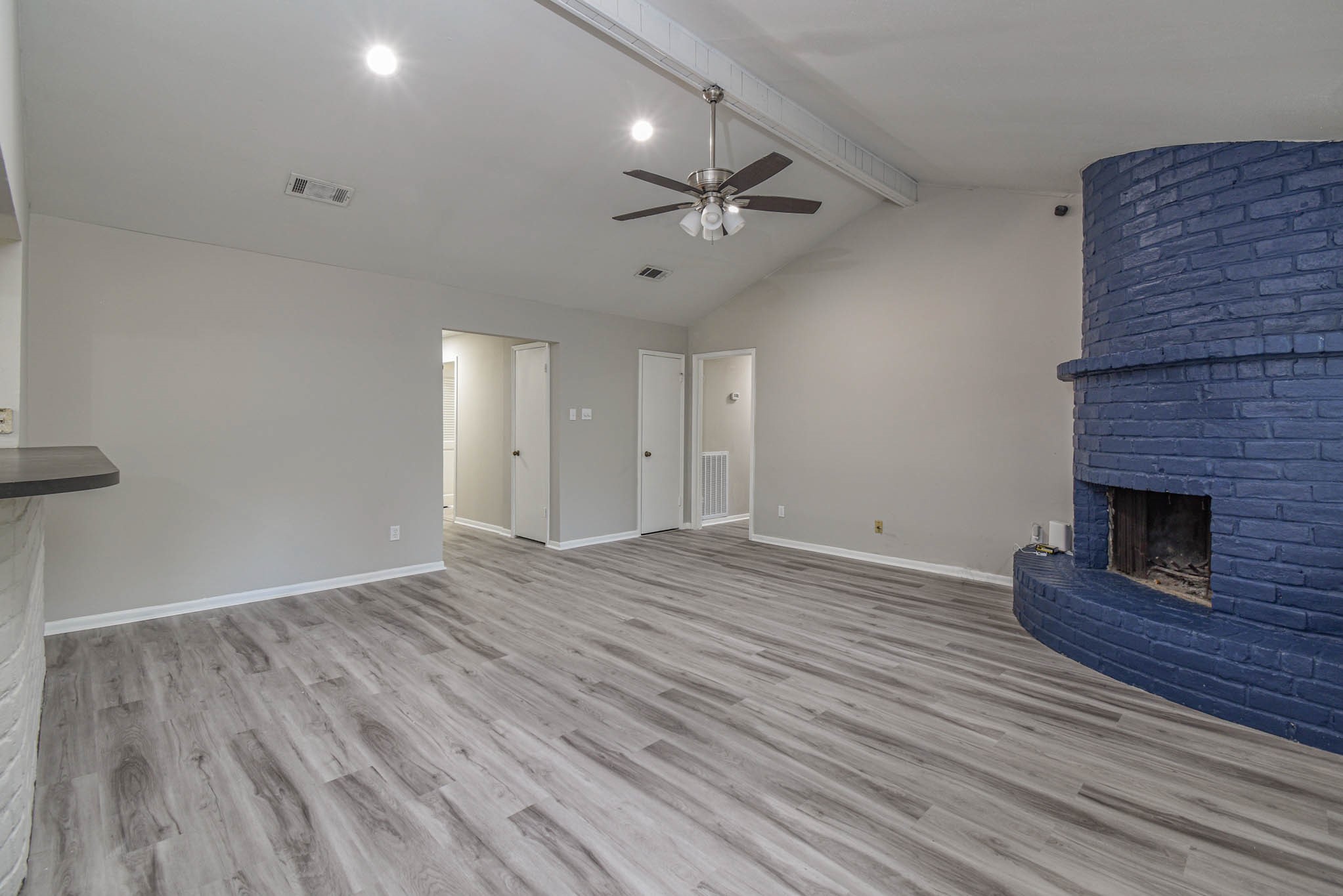17311 Methil Drive Spring, TX 77379 - Photo 5 of 24 a view of empty room with wooden floor and fireplace