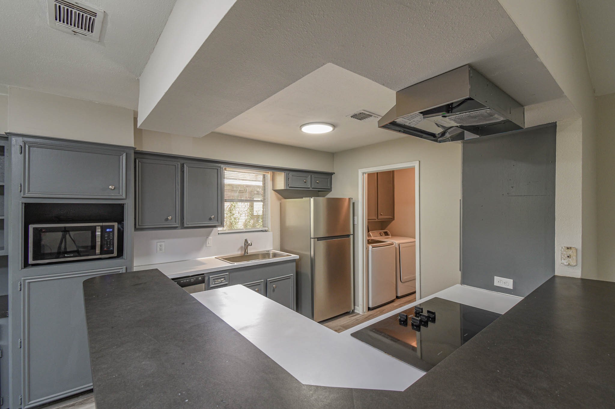 17311 Methil Drive Spring, TX 77379 - Photo 9 of 24 a kitchen with refrigerator and window