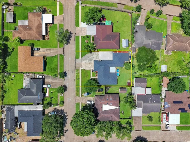 an aerial view of residential houses with outdoor space