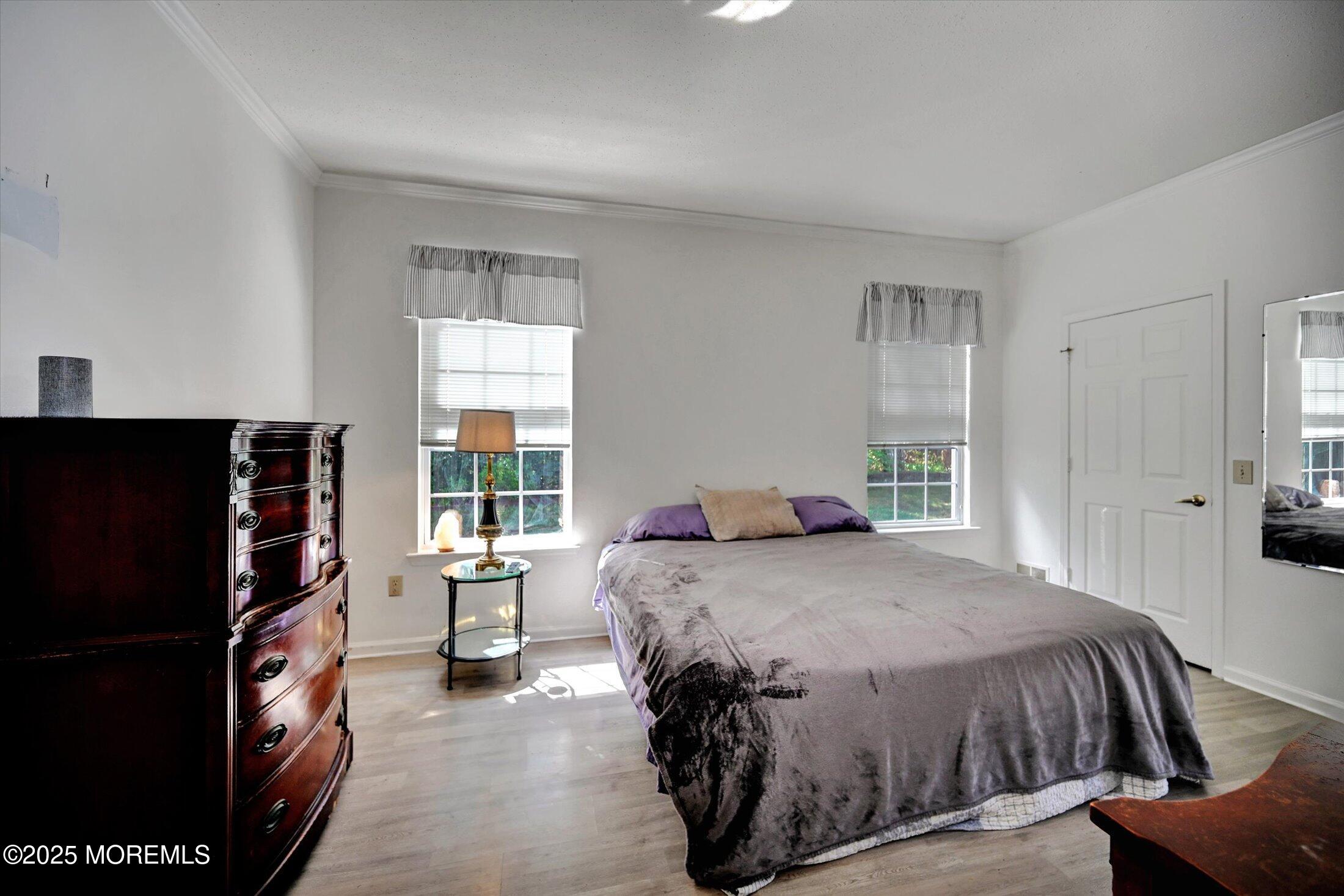 56 Quail Road Barnegat, NJ 08005 - Photo 13 of 30 a bedroom with a bed and a window