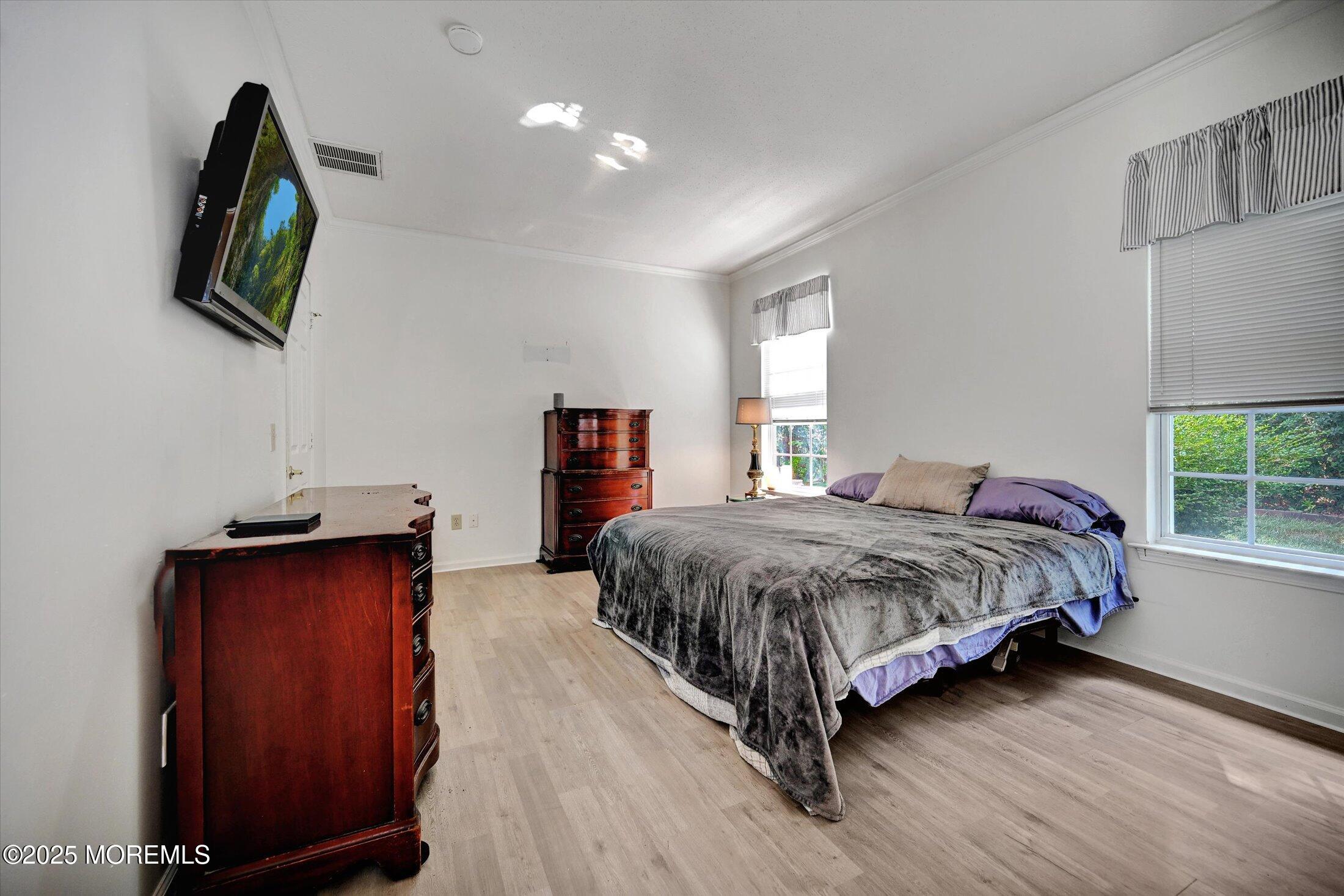 56 Quail Road Barnegat, NJ 08005 - Photo 14 of 30 a spacious bedroom with a bed and a mirror