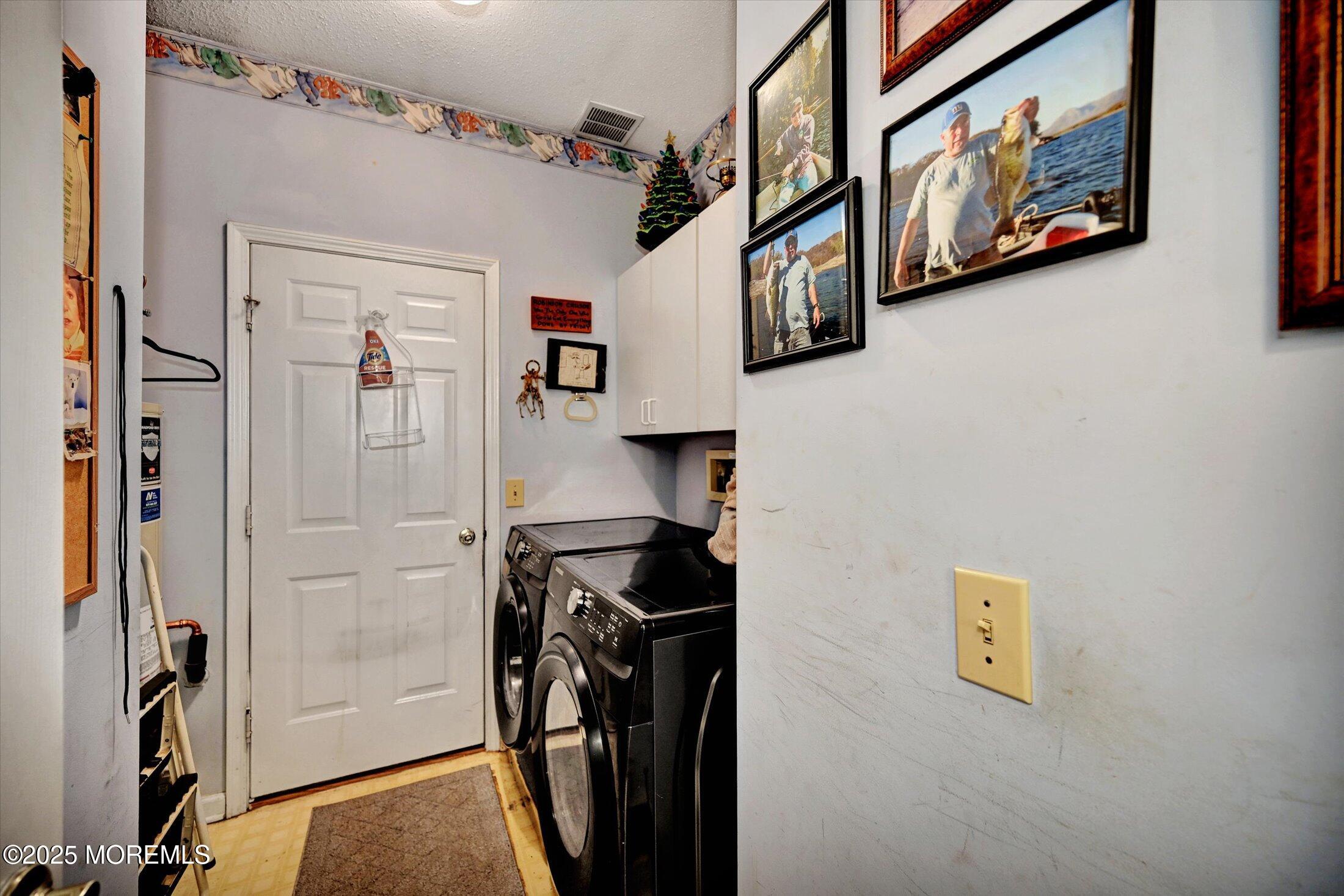 56 Quail Road Barnegat, NJ 08005 - Photo 21 of 30 a view of a hallway with paintings on the wall