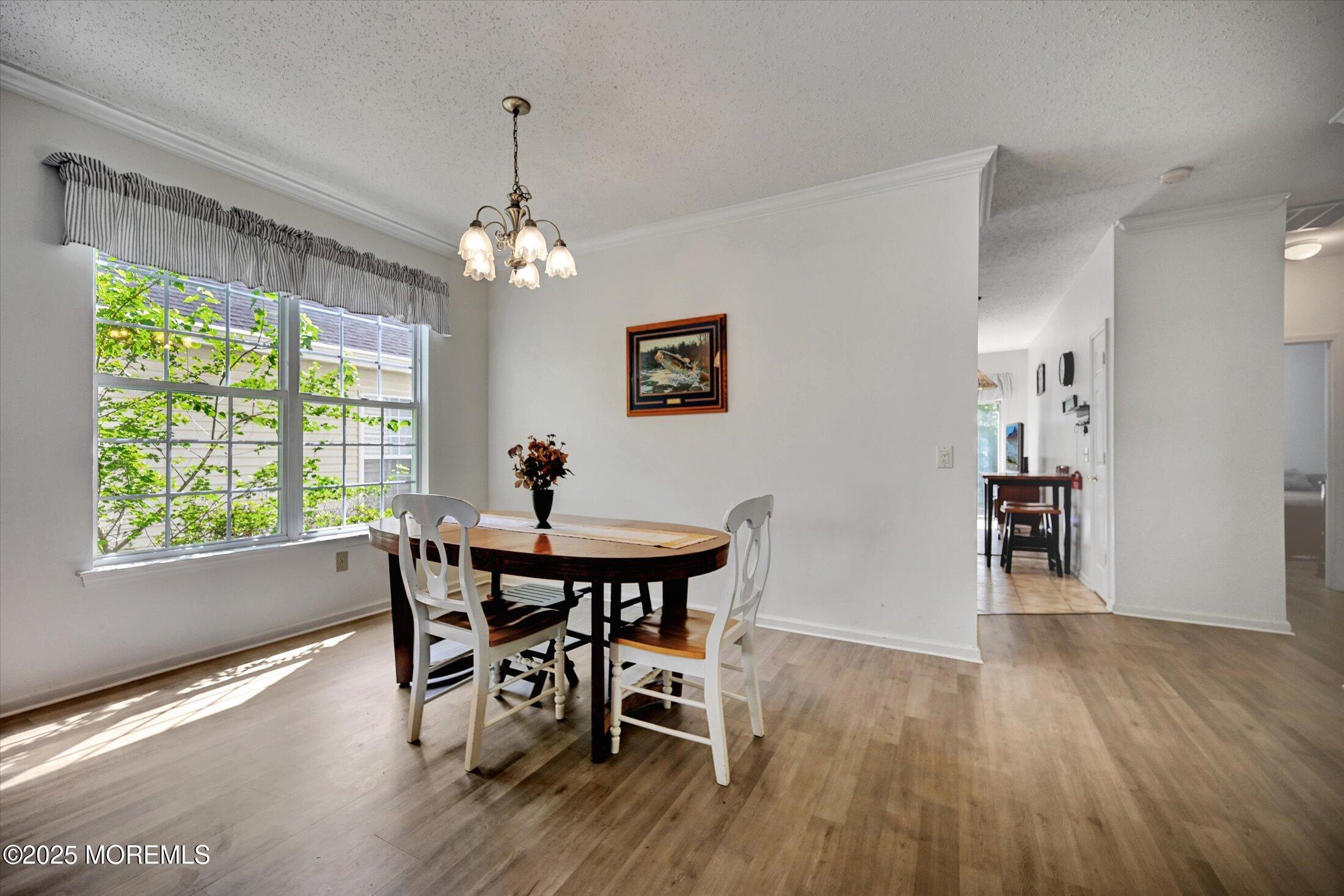 56 Quail Road Barnegat, NJ 08005 - Photo 6 of 30 a view of a dining room with furniture window and wooden floor